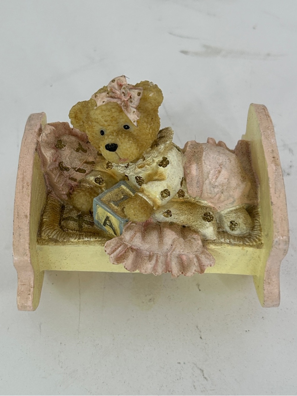 Teddy Bear Figurine on Pink and Cream Bed - Decorative Home Accent